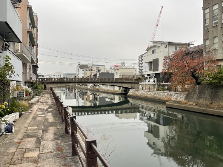 A canal with buildings and a bridge